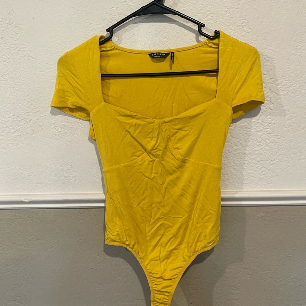 Mustard yellow A-Line bodysuit with clasps